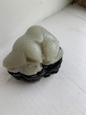 Lot 1 - A Chinese carved celadon jade group of quail, Qing Dynasty, 18th/19th century.