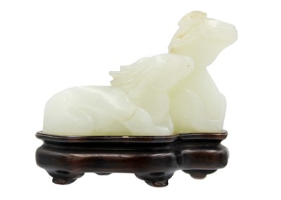 Lot 2 - A Chinese carved celadon jade group of deers, Qing Dynasty, 19th century.