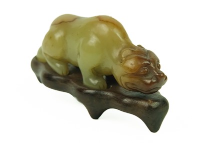 Lot 3 - A Chinese russet jade tiger, Qing Dynasty, 19th century.