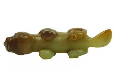 Lot 3 - A Chinese russet jade tiger, Qing Dynasty, 19th century.