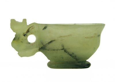 Lot 4 - A small Chinese jade and black nephrite libation cup, Qing Dynasty.
