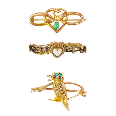 Lot 124 - Three gold stone set brooches.