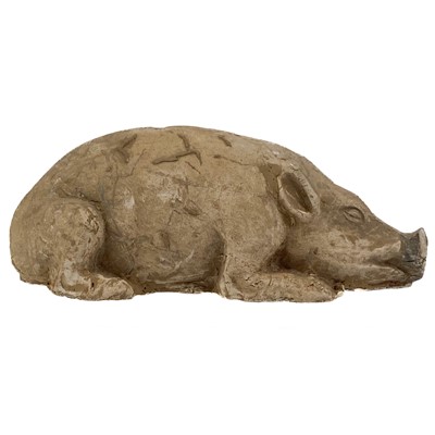 Lot 1379 - A Chinese pottery model of a recumbent pig, Han Dynasty