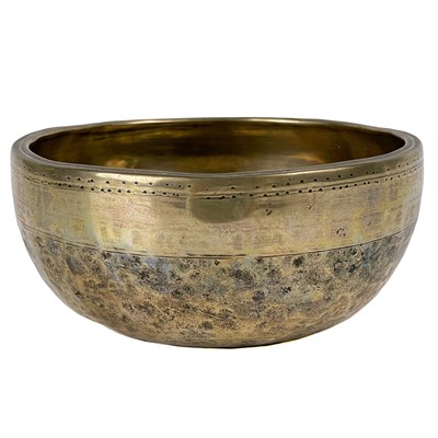 Lot 1398 - A Tibetan hammered and polished bronze singing bowl.