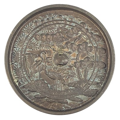 Lot 1402 - A Japanese bronze hand mirror, 19th century.