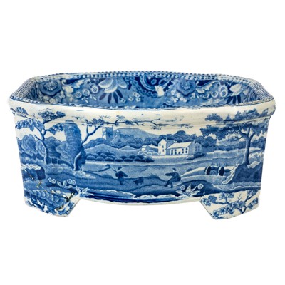 Lot 130 - A 19th century English pottery blue and white transfer printed dog bowl.