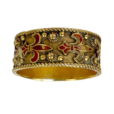 Lot 23 - A 14ct gold and red champleve enamel band ring.