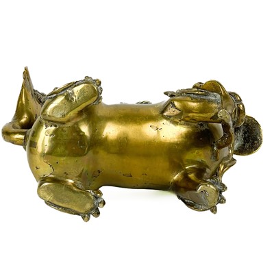 Lot 1424 - A Chinese polished bronze model of a dog of fo, late 19th century.