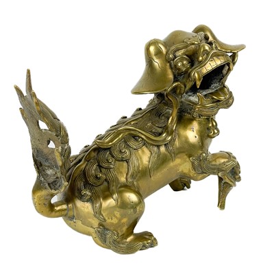 Lot 1424 - A Chinese polished bronze model of a dog of fo, late 19th century.