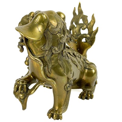 Lot 1424 - A Chinese polished bronze model of a dog of fo, late 19th century.