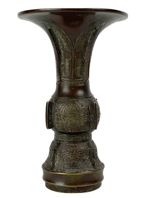 Lot 1425 - A Chinese bronze Gu vase, late 19th century.