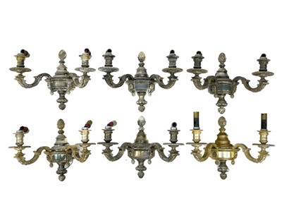 Lot 278 - A set of six early 20th century silvered metal twin branch wall appliques.