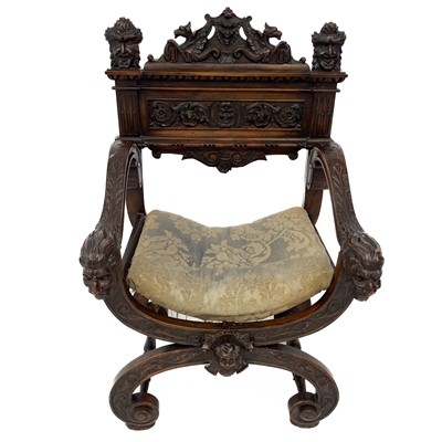 Lot 133 - An Italian walnut X framed armchair.