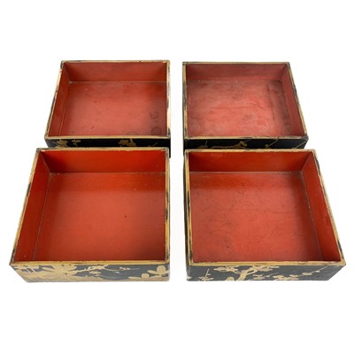 Lot 1431 - Four Japanese black lacquered stacking boxes, circa 1900.