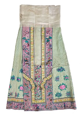 Lot 1453 - A Chinese silk embroidered skirt, early 20th century.