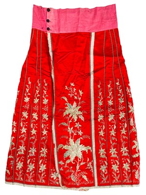 Lot 1457 - A Chinese red silk and metal thread skirt, early 20th century.