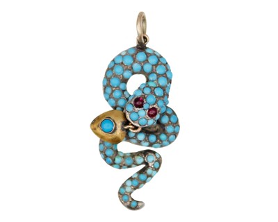 Lot 291 - A Victorian gold and silver turquoise and garnet set snake pendant.