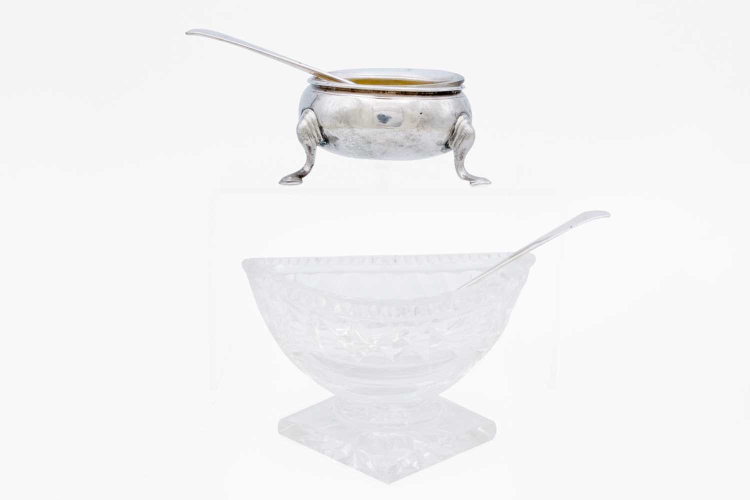 Lot 28 - A silver open salt dish with a matched spoon.