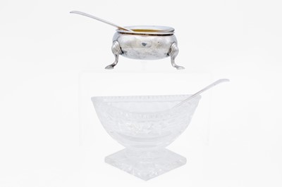 Lot 28 - A silver open salt dish with a matched spoon.