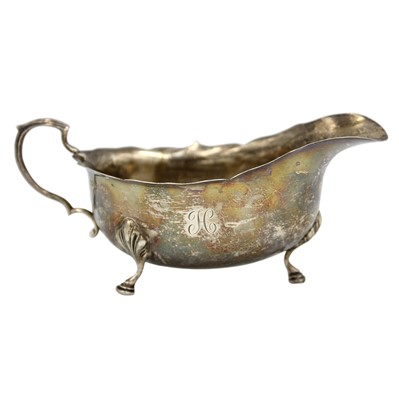 Lot 17 - An Edward VII silver sauce boat by Walker and Hall.
