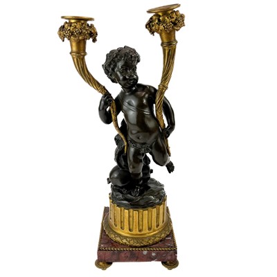 Lot 3 - A pair of French bronze and ormolu figural candelabra, after Clodion.