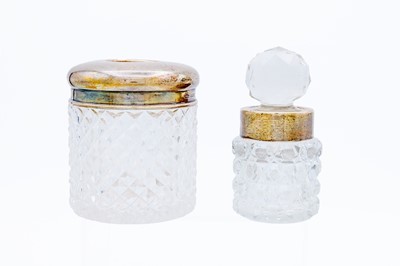 Lot 8 - A silver lidded cut glass jar by John Grinsell & Sons.