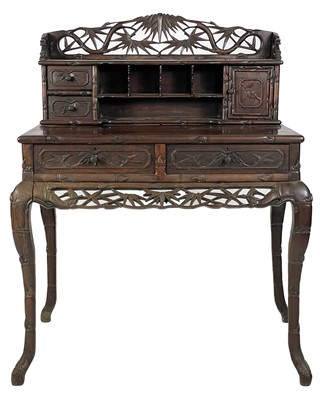 Lot 1458 - A Chinese carved hongmu writing desk, 19th century.