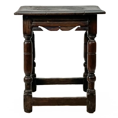 Lot 214 - A joined oak stool.