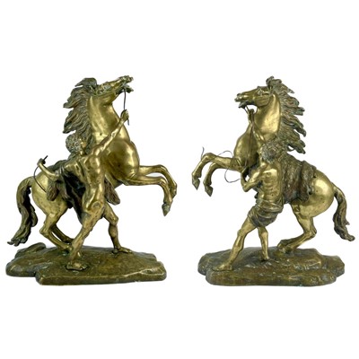 Lot 285 - A substantial pair of brass Marly horses, After Coustou.