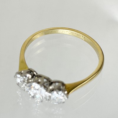Lot 141 - A good 18ct diamond set three-stone ring.