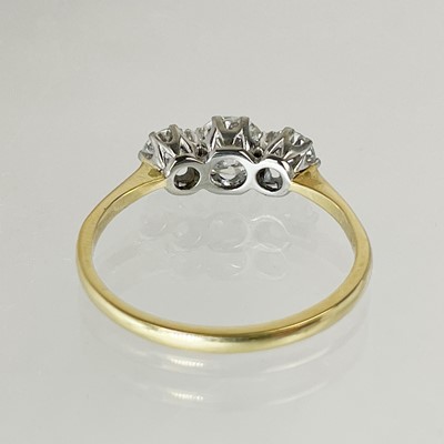 Lot 141 - A good 18ct diamond set three-stone ring.