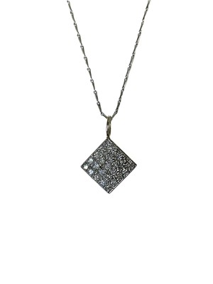 Lot 92 - An 18ct white gold diamond set lozenge shape pendant.
