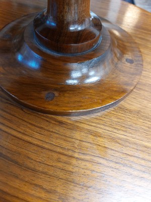 Lot 60 - An early 20th century walnut Lazy Susan.