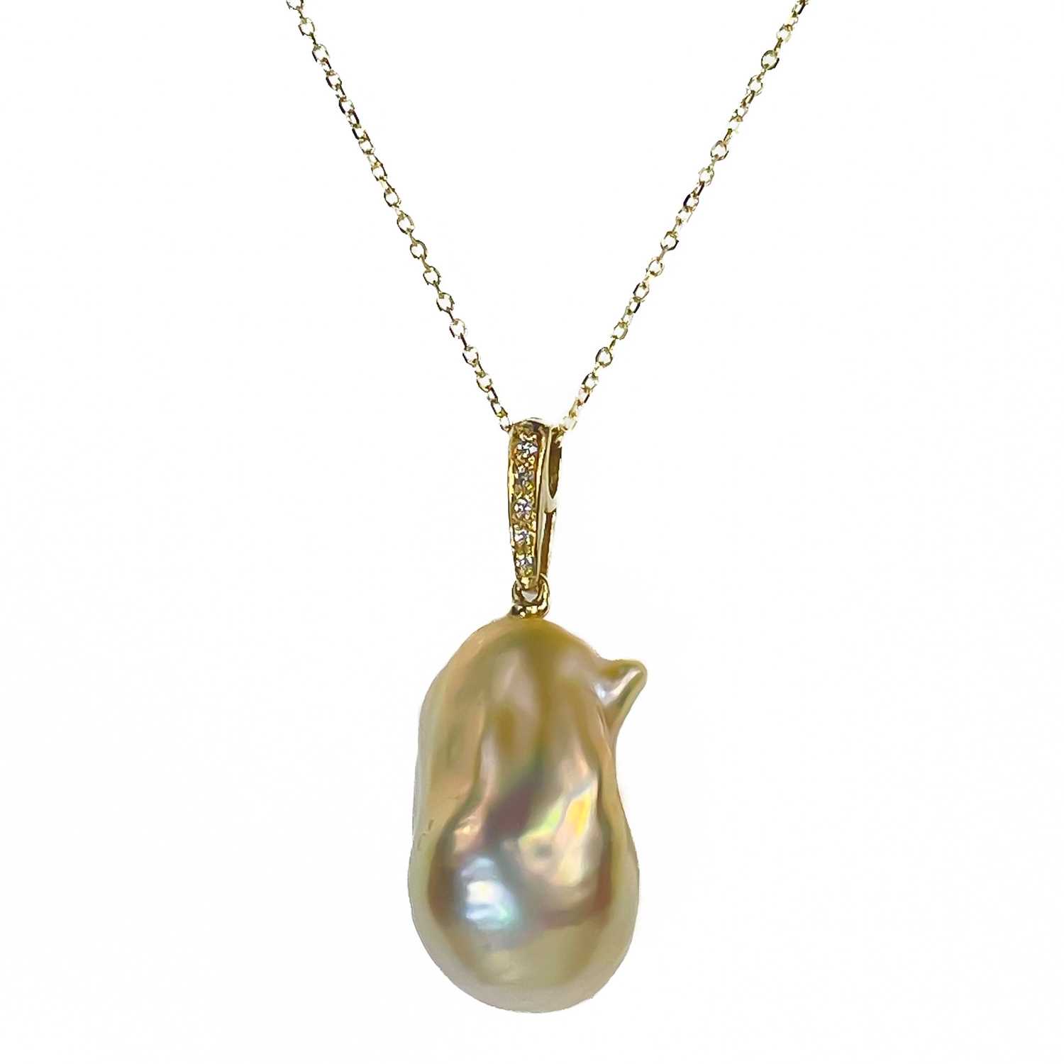 Lot 40 - A contemporary 18ct pendant with a suspended large Baroque cultured pearl and with diamond set bale.