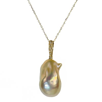 Lot 40 - A contemporary 18ct pendant with a suspended large Baroque cultured pearl and with diamond set bale.