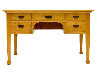 Lot 656 - A satin birch and bird's eye maple writing table.