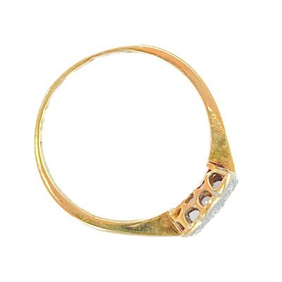 Lot 165 - A diamond pave set panel gold ring.