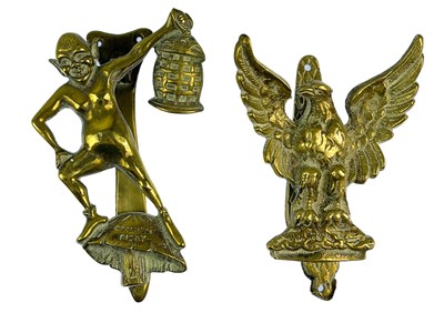 Lot 82 - A collection of nine novelty brass door knockers.