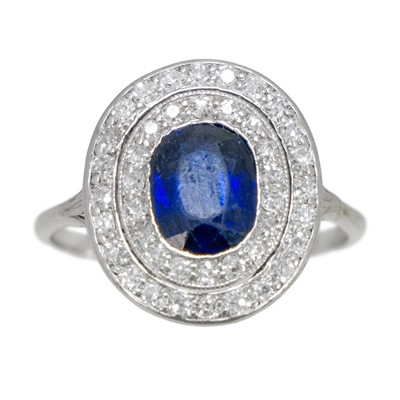 Lot 152 - A platinum diamond and sapphire set target ring.