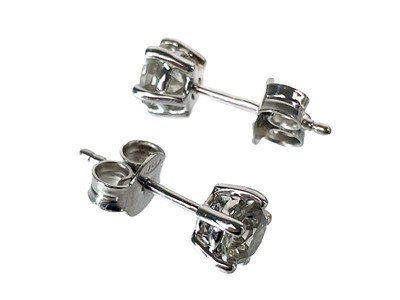 Lot 284 - A pair of certified diamond set solitaire stud earrings.