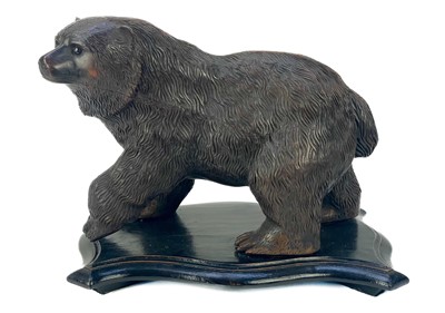 Lot 326 - A carved walnut Black Forest style figure of a bear.