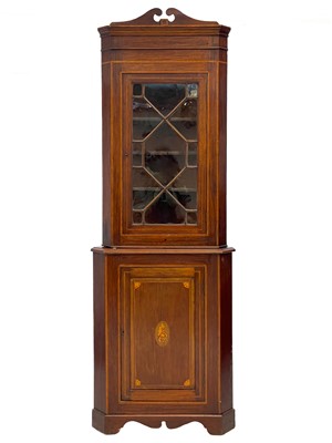 Lot 623 - An Edwardian mahogany and inlaid standing corner cupboard.