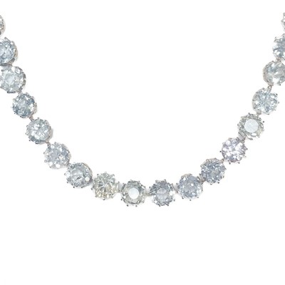 Lot 372 - A white sapphire 14ct rose gold set Riviere necklace.