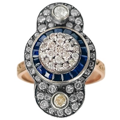 Lot 36 - An 8ct rose gold Georgian style diamond and sapphire set elongated cluster dress ring.