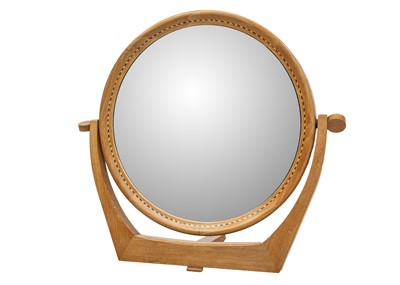 Lot 64 - A mid century walnut inlaid circular dressing table mirror.