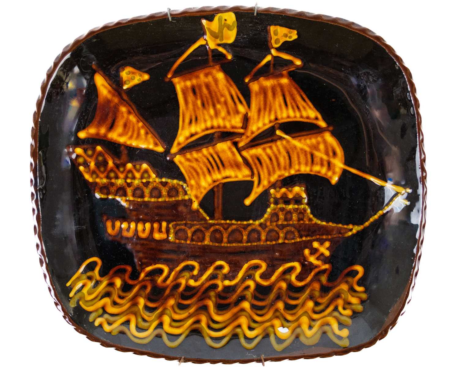 Lot 442 - A studio pottery slipware dish.