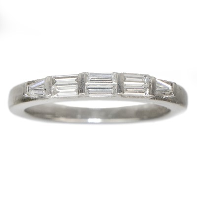 Lot 158 - A platinum diamond set eight stone ring.