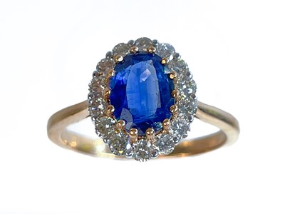 Lot 5 - An 18ct rose gold certified kyanite and diamond cluster ring.