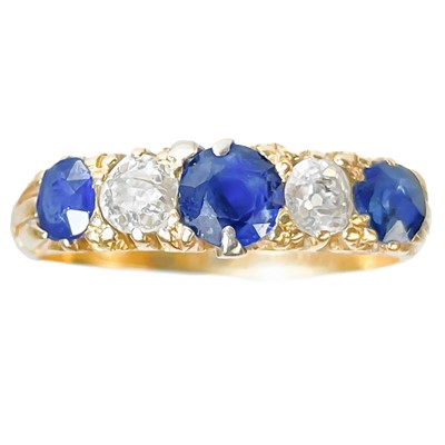 Lot 288 - An 18ct diamond and sapphire five stone ring.