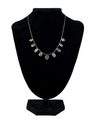 Lot 53 - A gold set blue Moonstone fringe necklace.